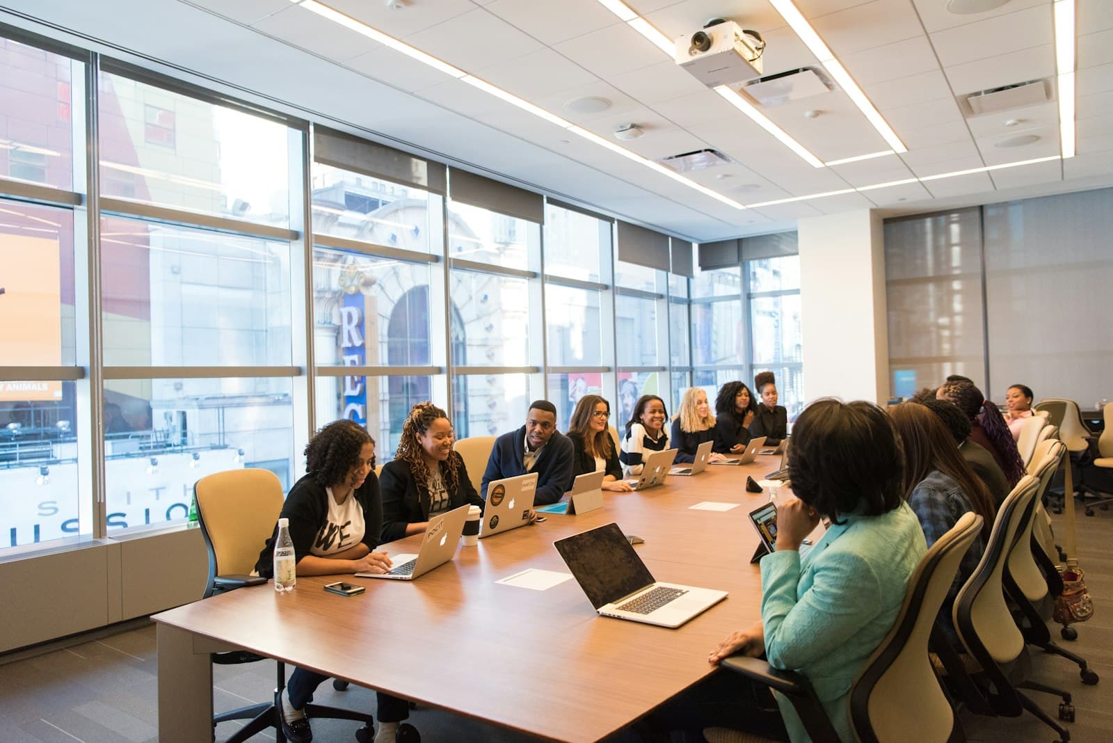 A woman presenting a plan to colleagues around a table